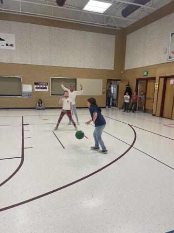 Three other 4th grade girls playing basketball
