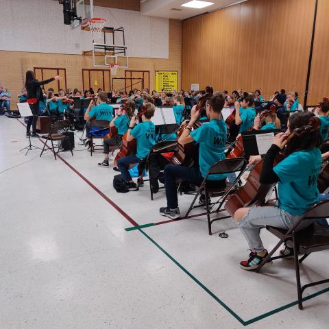 Maple Grove Middle School orchestra students performing for Rees 5th graders