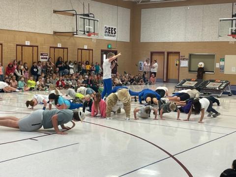 Students and BYU Dunk Team doing pushups, different view