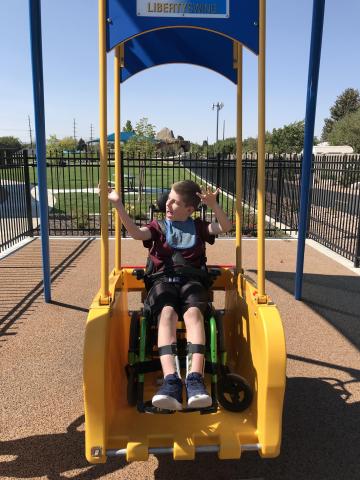 Boy in wheelchair swing