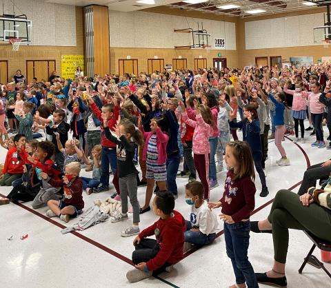 Rees students participating in dance assembly 