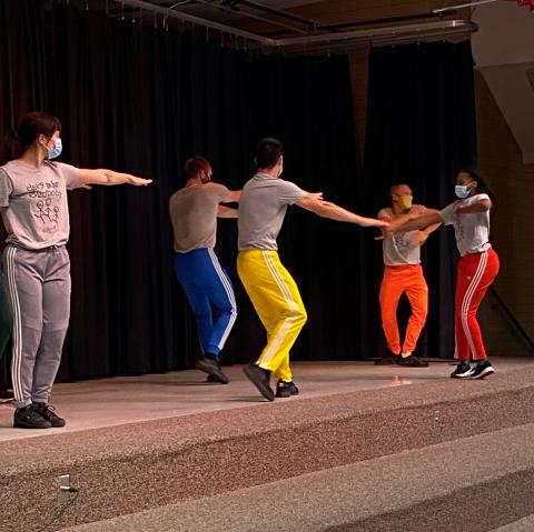 Five dancers on stage
