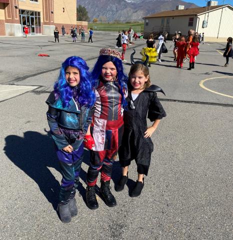 Three girls at recess in costumes