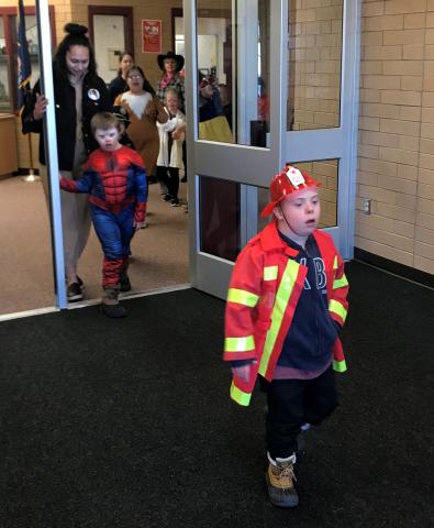 Boys dressed as fireman and spiderman