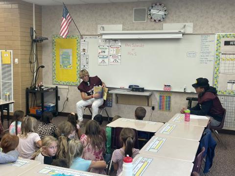 MMHS football players reading to students