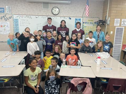MMHS football players with Ms. Saxon's class
