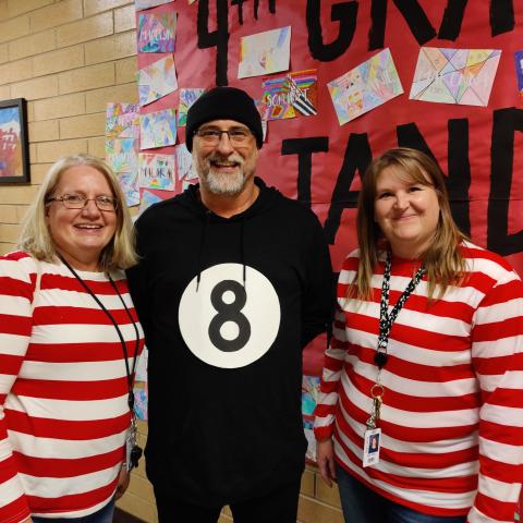 5th grade teachers dressed as Waldo and an eight ball