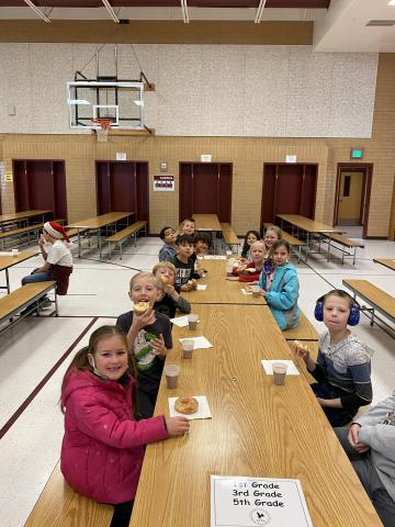 More students enjoying their donut and chocolate milk 