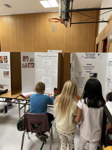 Other 5th graders with their science fair projects. 