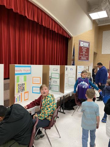Rees boys presenting their projects to second grade students. 