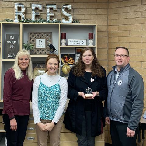 Mrs. Hirst received Crystal Apple award, standing with Mrs. Searle, Ms. Wilzbach, and Mr. Gull