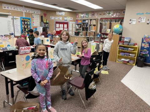 Second grade boys and girls enjoying their class store