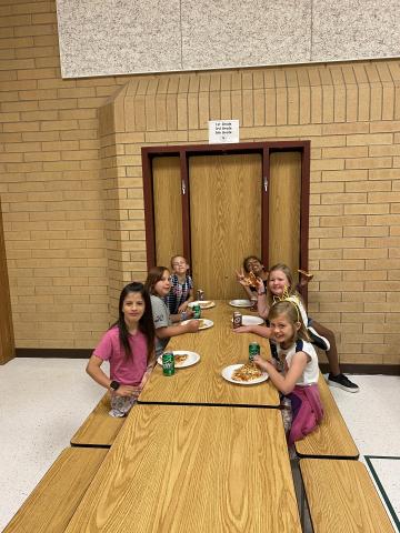Rees girls enjoying  their pizza and soda at the pizza party with Mr. Gull