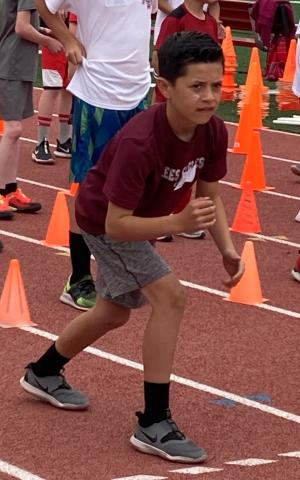 4th grade boy ready to begin a race