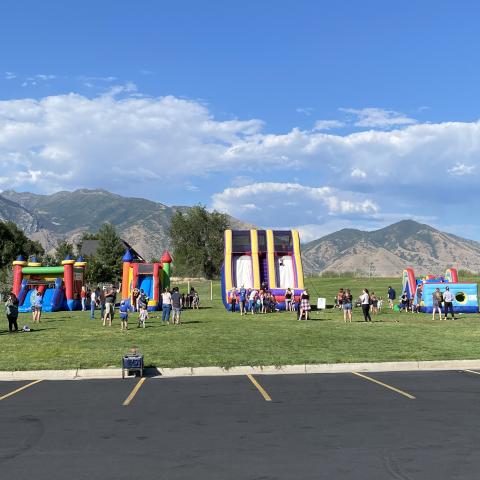 Students and families at the four bounce houses