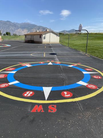 The outdoor compass and number circle painted on the blacktop