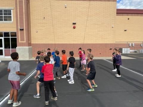 Students learning to play wallball the right way