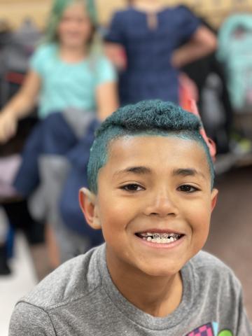 Rees boy with blue colored hair