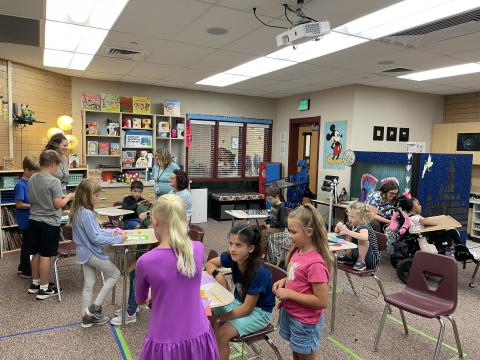 Rees students working with various students in Mrs. Hirst's class. 