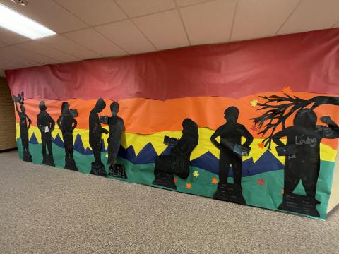 Hallway mural of book characters made by 4th grade students.