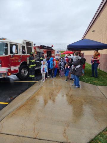Rees students standing in front of fire truck and learning from Spanish Fork Fire Department