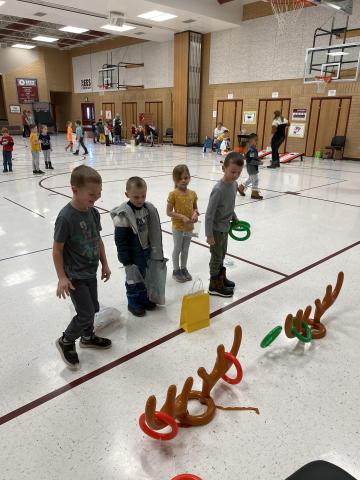 Rees boys playing reindeer ring toss at the reading carnival 
