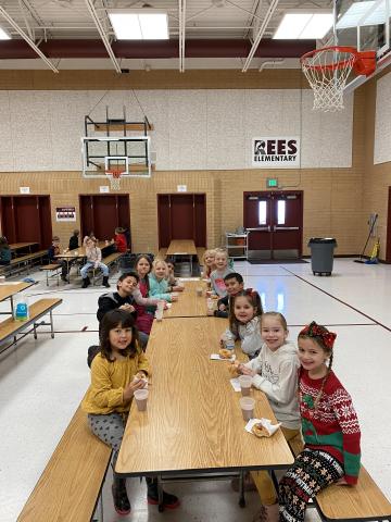 Rees boys and girls enjoying their donuts and chocolate milk 
