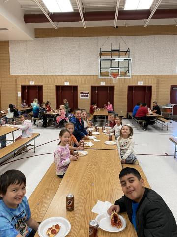 Rees boys and girls enjoying their pizza and root beer