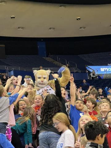 Rees students gathered around Cosmo at the BYU game