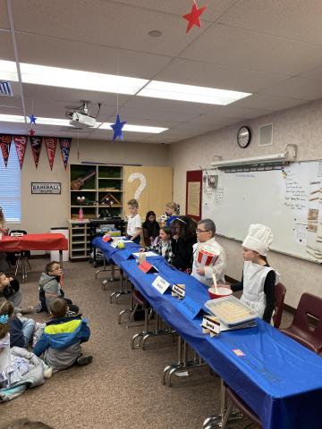 5th grade students presenting during the wax museum
