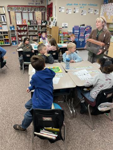 Hogle Zoo employee talking to Rees students in their classroom
