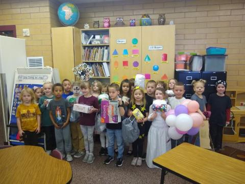 Mrs. Bodily's class standing in their classroom dressed up. 