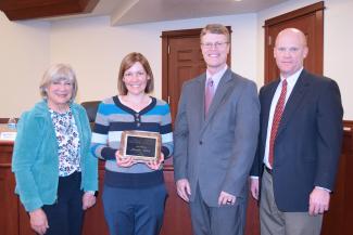 Ms. Saxon receiving Teacher of the Year award. Pictured with School Board President Christine Riley, Superintendent Rick Nielsen, Elementary Director Dave Rowe.