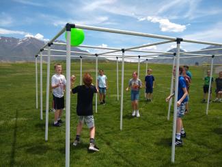 4th grade students playing nine square outside during field day