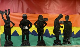Fourth Grade made black paper characters from books they read and these are displayed in a mural in the hallways