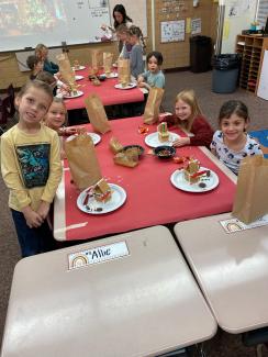 Rees 1st grade students decorating their candy houses in Mrs. Marshall's class.