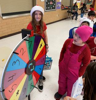 Rees students playing the spinning wheel